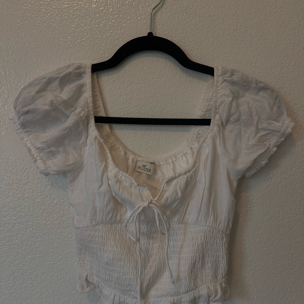 White hollister shirt.